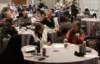 Conference meeting with people interacting at tables