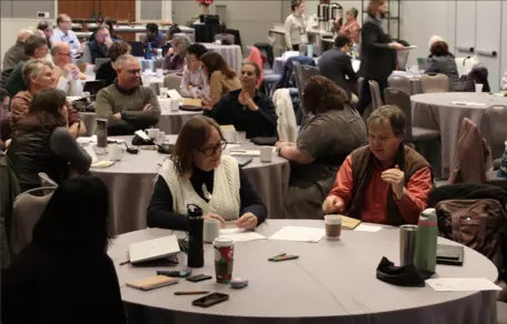 Conference meeting with people interacting at tables