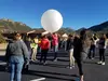 PROGRESS workshop participants outside  preparing a weather balloon
