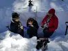 People in a snow trench
