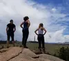 Undergraduate researchers look out over a 20 year old burn scar after completing field research