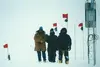 REU participant Elaine Godfrey (center) and teammates at the top of the Greenland ice cap after successfully repairing a magnetometer