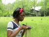 Kimmie Bowen checks on a field instrument as part of a research project at Penn State University
