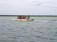 William and Mary geology students in a boat