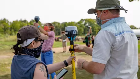 Students and instructor use Emlid ReachRS2 GPS receivers in the field near Earlham College.