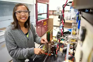 Student working on a hydrogen fuel cell 