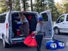 Students packing van to leave camp