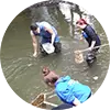 Students sampling a river circle