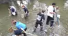 Students sampling a river