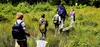 Students in the field with nets.