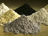 Piles of finely ground materials that represent ciritical minerals