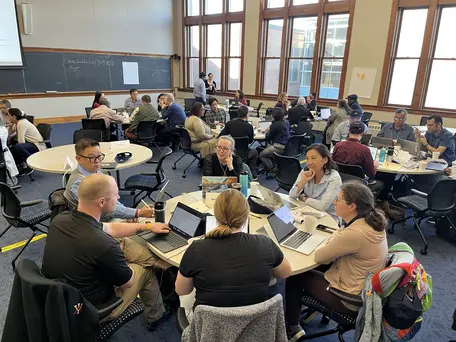 Participants working in groups at the 2025 MATLAB workshop